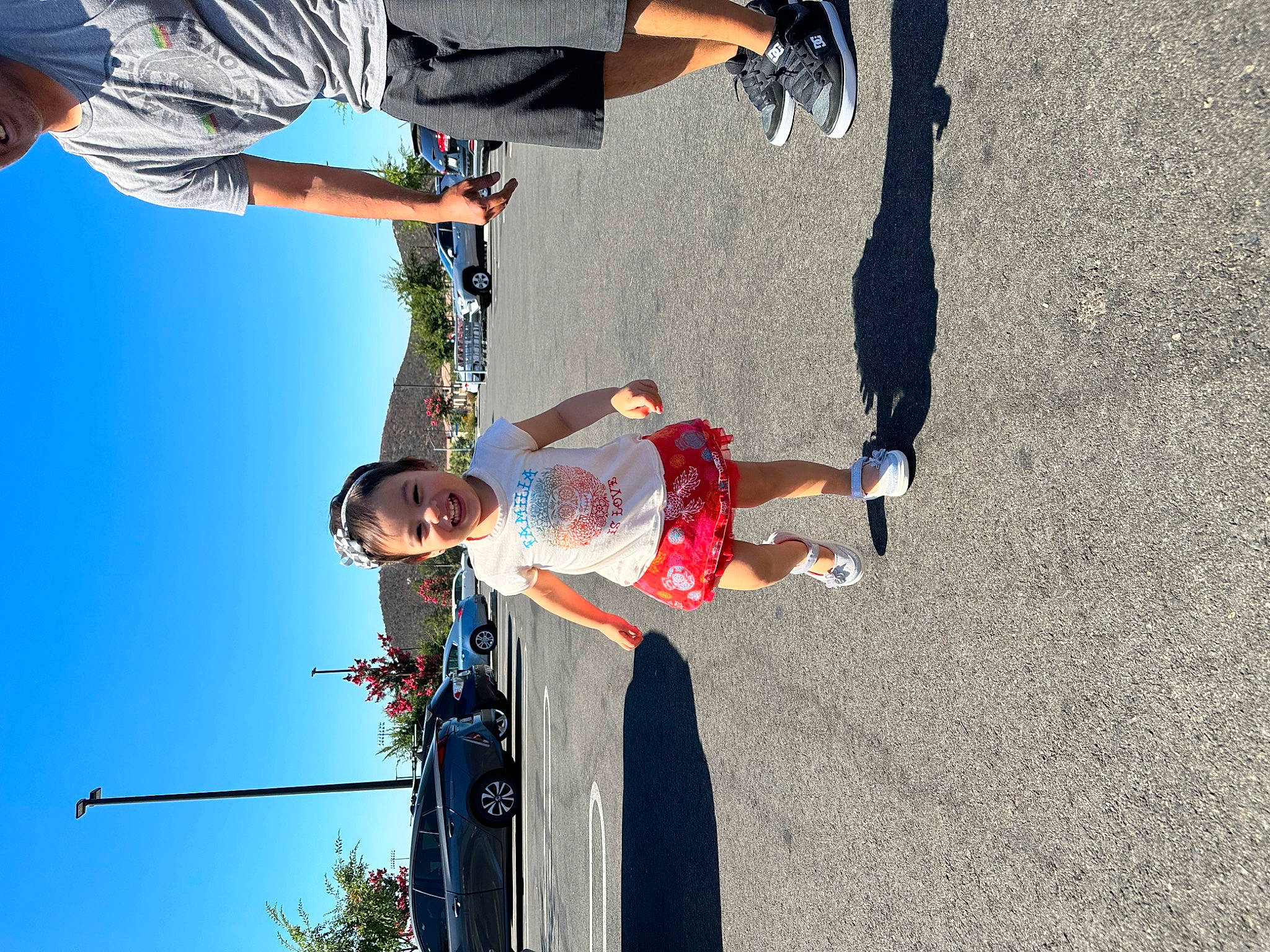 Liliana joined the competition — help win amazing prizes! asphalt, electric_blue, fun, human_leg, joy, leisure, light, line, pedestrian, person, recreation, shadow, shorts, sky, sneakers, street, t_shirt, tree, trousers, walking_shoe