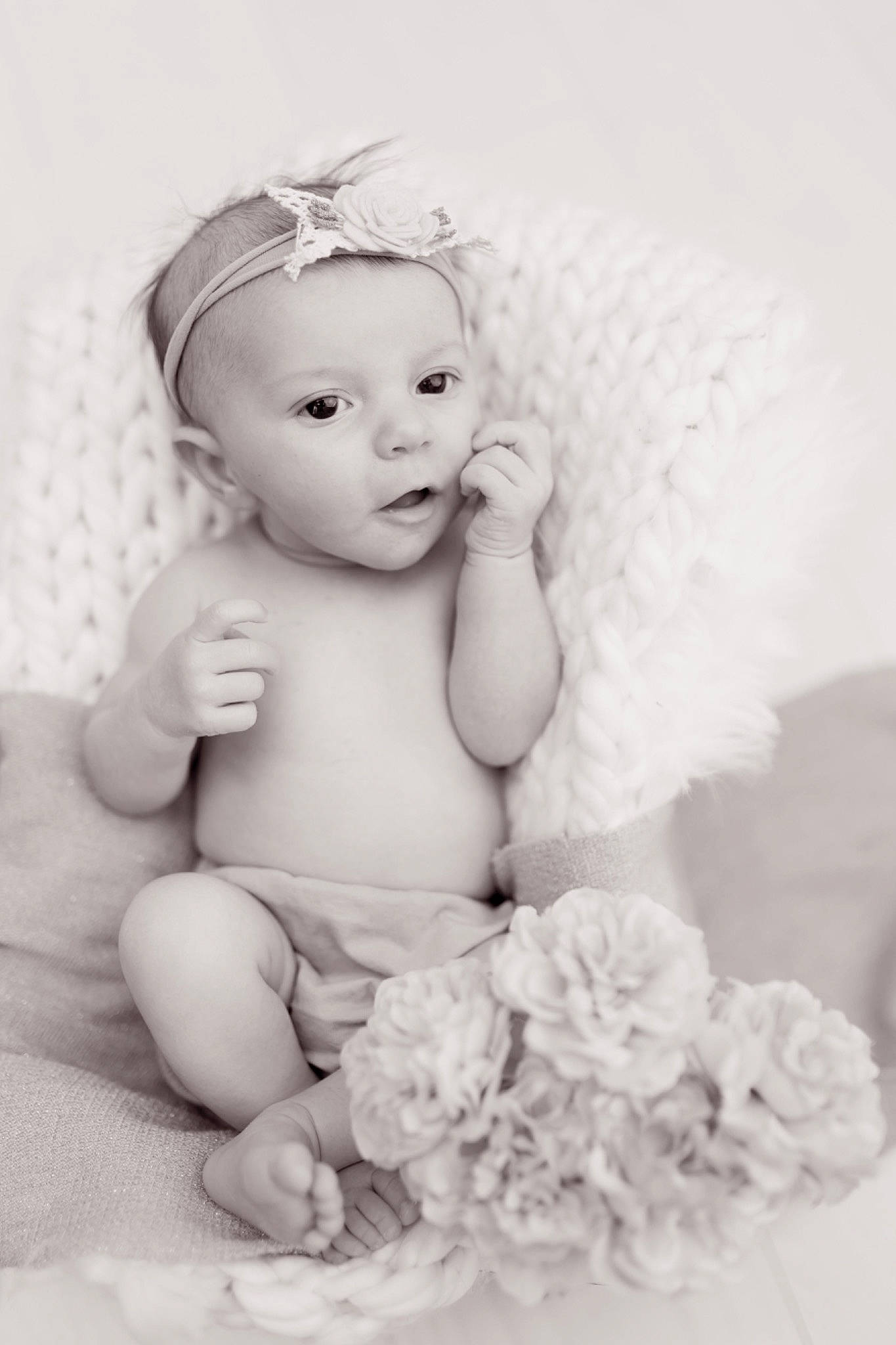 Brooke participe au concours pour gagner de l'argent avec cette photo : baby, baby_toddler_clothing, child, fashion_accessory, flash_photography, flower, hair_accessory, happy, headband, headgear, headpiece, iris, monochrome, monochrome_photography, people, person, petal, sitting, style, toddler