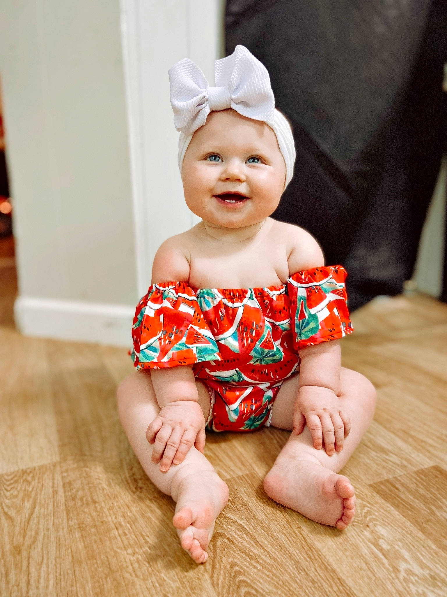 Kinslee joined the competition — help win amazing prizes! baby, baby_toddler_clothing, cheek, child, face, finger, flooring, foot, happy, hardwood, head, headwear, human_body, human_leg, joy, pattern, person, sitting, skin, sleeve