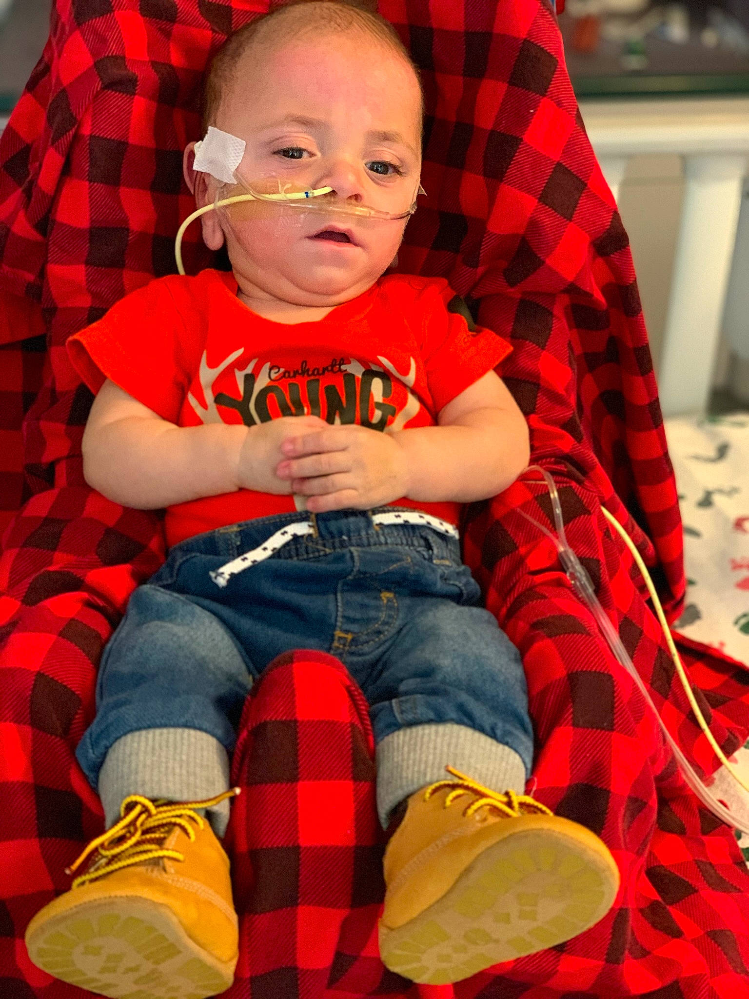 Leo is registered to the contest to win money with this photo: baby_toddler_clothing, cheek, child, cool, facial_expression, fashion, fun, human, jeans, person, plaid, red, shoe, sleeve, sneakers, standing, t_shirt, tartan, textile, toddler