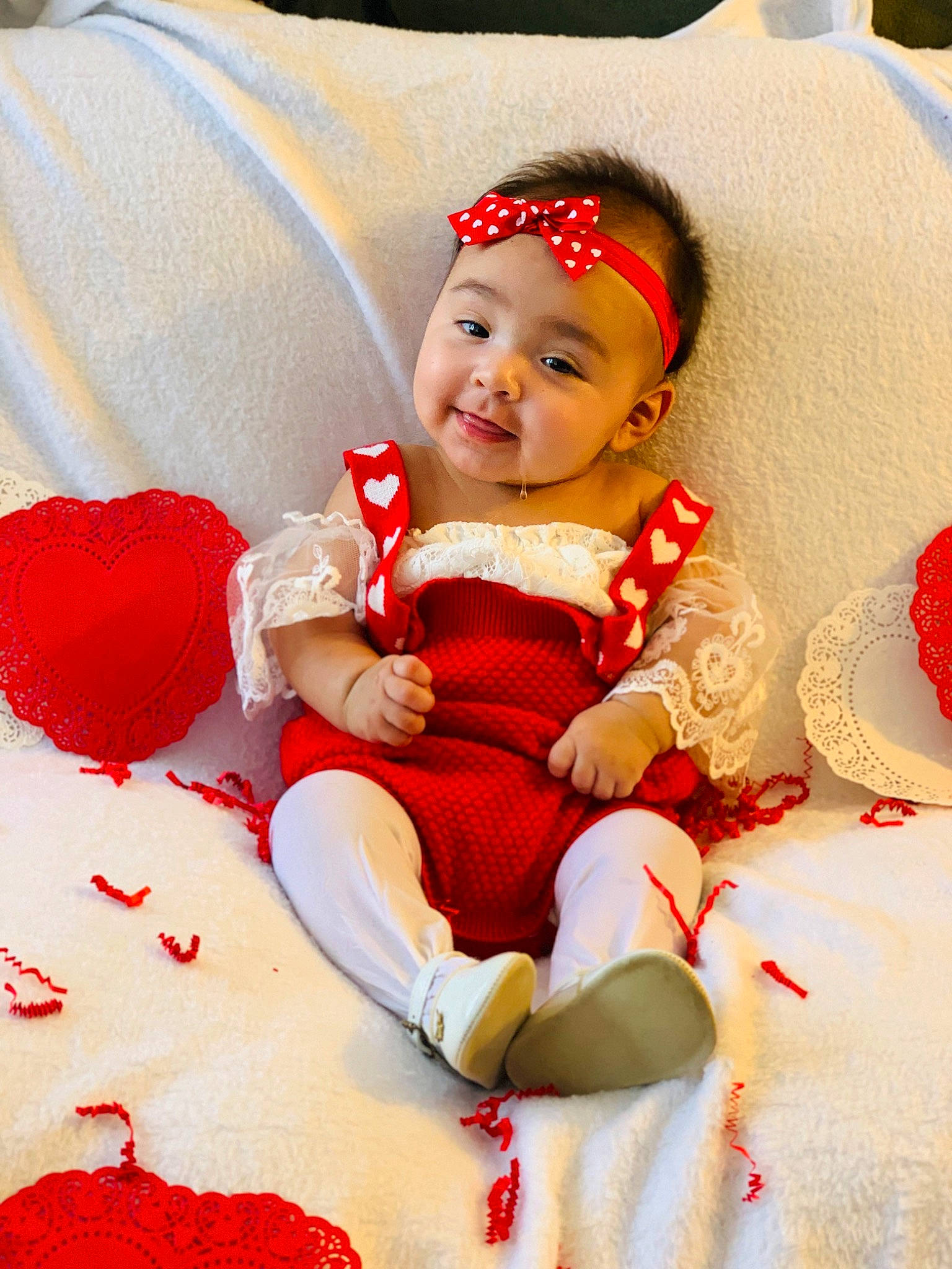 Alicianna is registered to the contest to win money with this photo: baby, baby_toddler_clothing, carmine, comfort, event, fun, happy, hat, head, human_leg, joy, lap, pattern, person, red, sitting, skin, sleeve, smile, sock