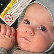 Leo joined the competition — help win amazing prizes! baby, infant, closeup, face, hands, hood, blue_eyes, chubby_cheeks, skin, cute, child, clothing, expression, portrait, young, person, sitting, indoors, warning_label, cute_expression