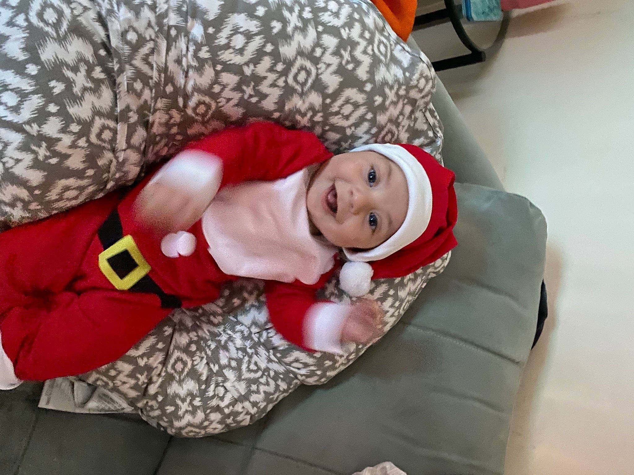 Joaquin joined the competition — help win amazing prizes! baby, boot, carmine, christmas, comfort, costume, costume_accessory, costume_hat, couch, fictional_character, fur, headwear, holiday, joy, lap, laugh, person, photo_shoot, red, velvet