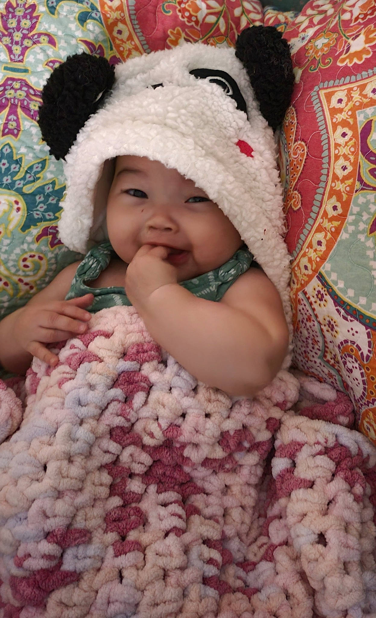 Paige is registered to the contest to win money with this photo: baby, baby_toddler_clothing, cap, cheek, eye, face, facial_expression, hand, happy, headwear, lip, mammal, organ, person, pink, product, skin, sleeve, smile, textile