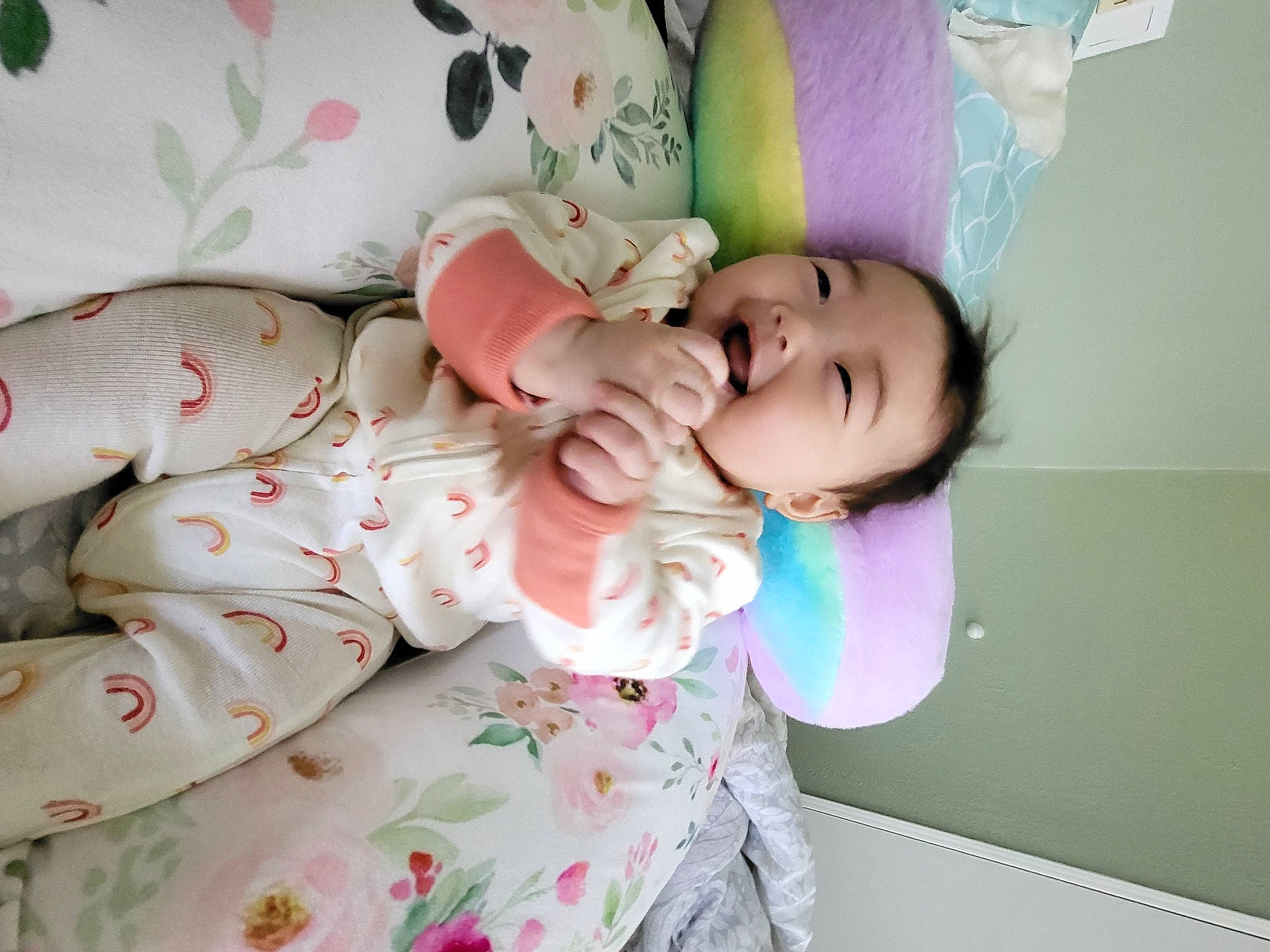 Paige is registered to the contest to win money with this photo: baby, baby_products, baby_toddler_clothing, bedding, bedtime, cheek, child, comfort, dress, happy, linens, magenta, pattern, person, petal, pink, room, skin, sleeve, smile