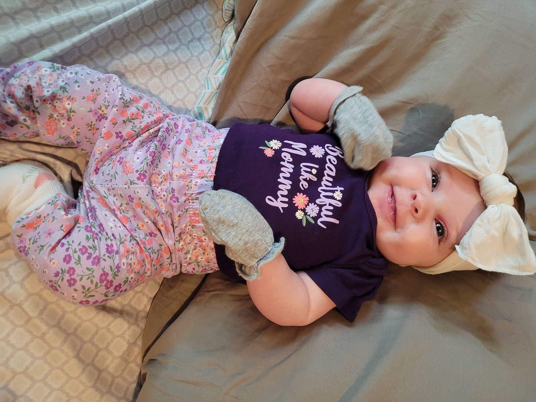 Alondra is registered to the contest to win money with this photo: arm, baby, baby_sleeping, baby_toddler_clothing, cap, child, comfort, elbow, glasses, hand, hat, headwear, human_body, leg, person, sitting, skin, sleeve, t_shirt, thigh