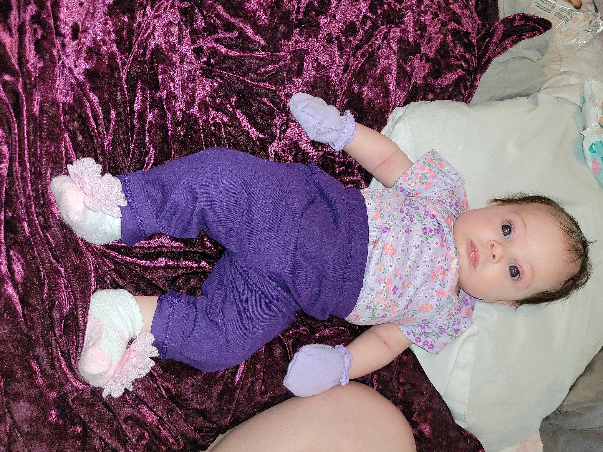 Alondra is registered to the contest to win money with this photo: arm, baby, baby_toddler_clothing, child, comfort, finger, human_leg, knee, leg, magenta, pattern, person, pink, purple, skin, sleeve, sock, textile, thigh, toddler
