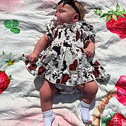 Tinley is registered to the contest to win money with this photo: baby, sleeping, dress, headband, pacifier, blanket, strawberry, pattern, sock, infant, child, cute, outdoor, soft, relaxing, sunlight, resting, colorful, fabric, small
