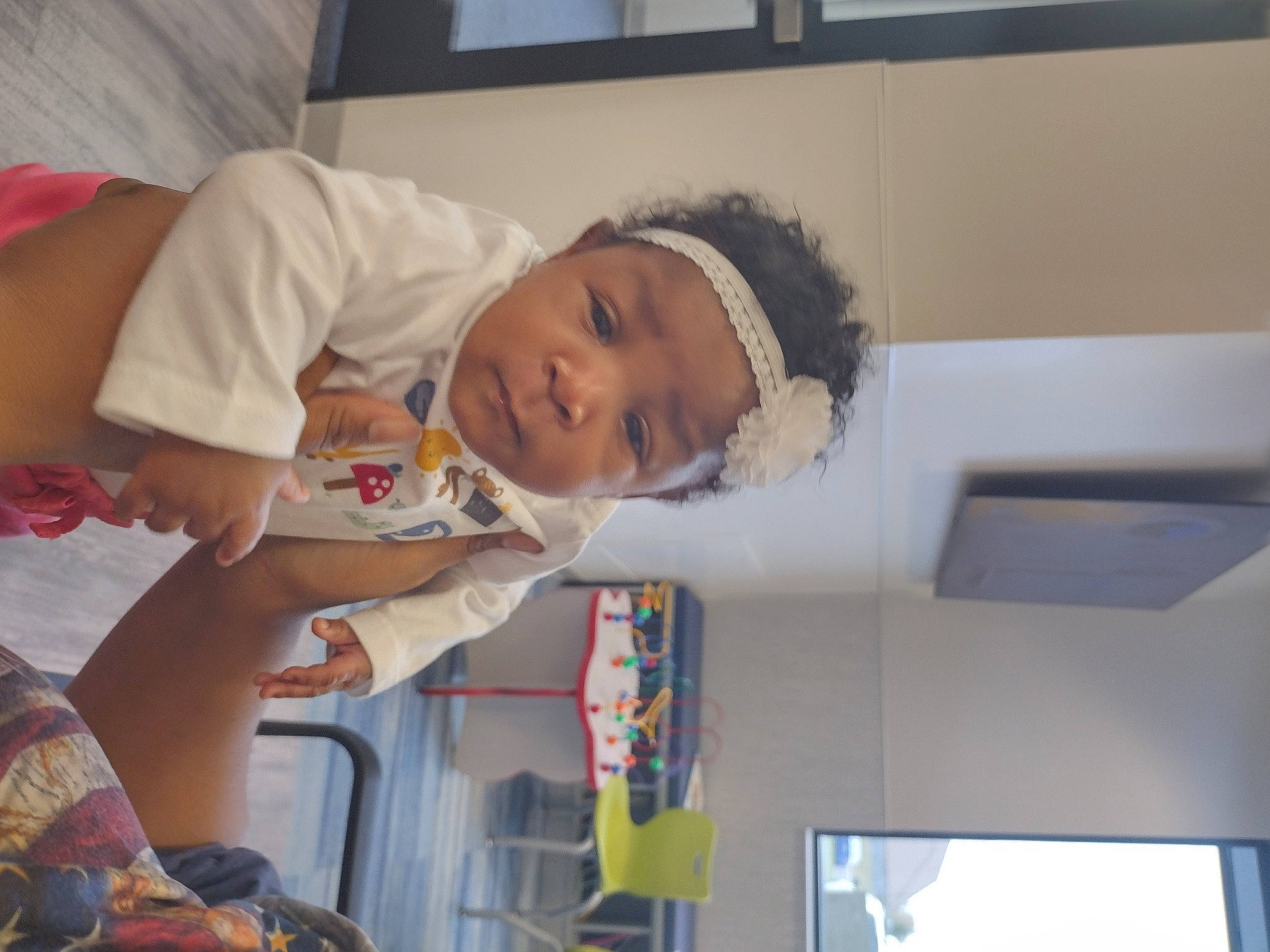 Harmoni joined the competition — help win amazing prizes! baby, child, comfort, facial_expression, fun, happy, person, room, t_shirt, toddler, vacation, window