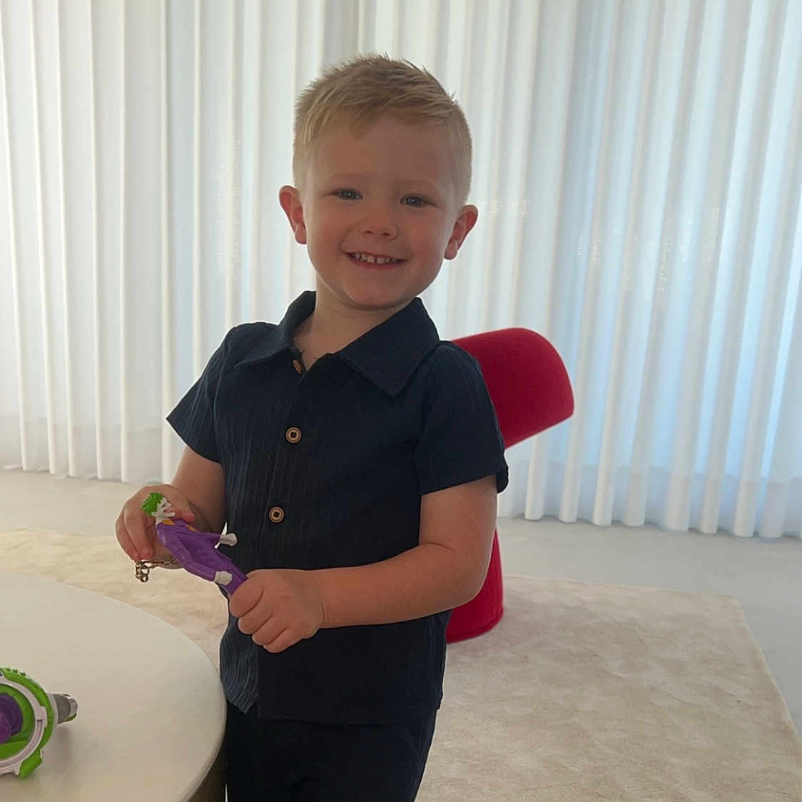 Jaxon-Sean is registered to the contest to win money with this photo: bodypart, boy, child, clothing, face, finger, footwear, furniture, hand, head, indoors, interiordesign, male, pants, person, photography, portrait, shoe, shorts, table