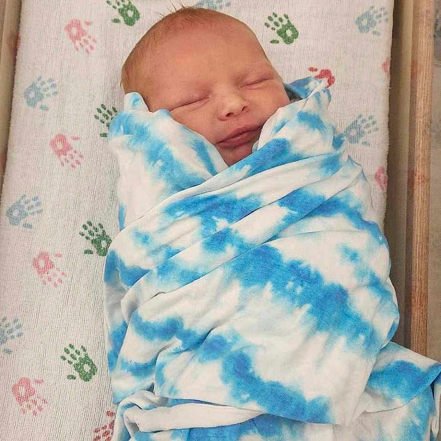 Tucker Hatcher is registered to the contest to win money with this photo: architecture, baby, bed, bedroom, blanket, building, cradle, crib, face, furniture, head, hospital, indoors, infantbed, newborn, person, photography, portrait, quilt, sleeping