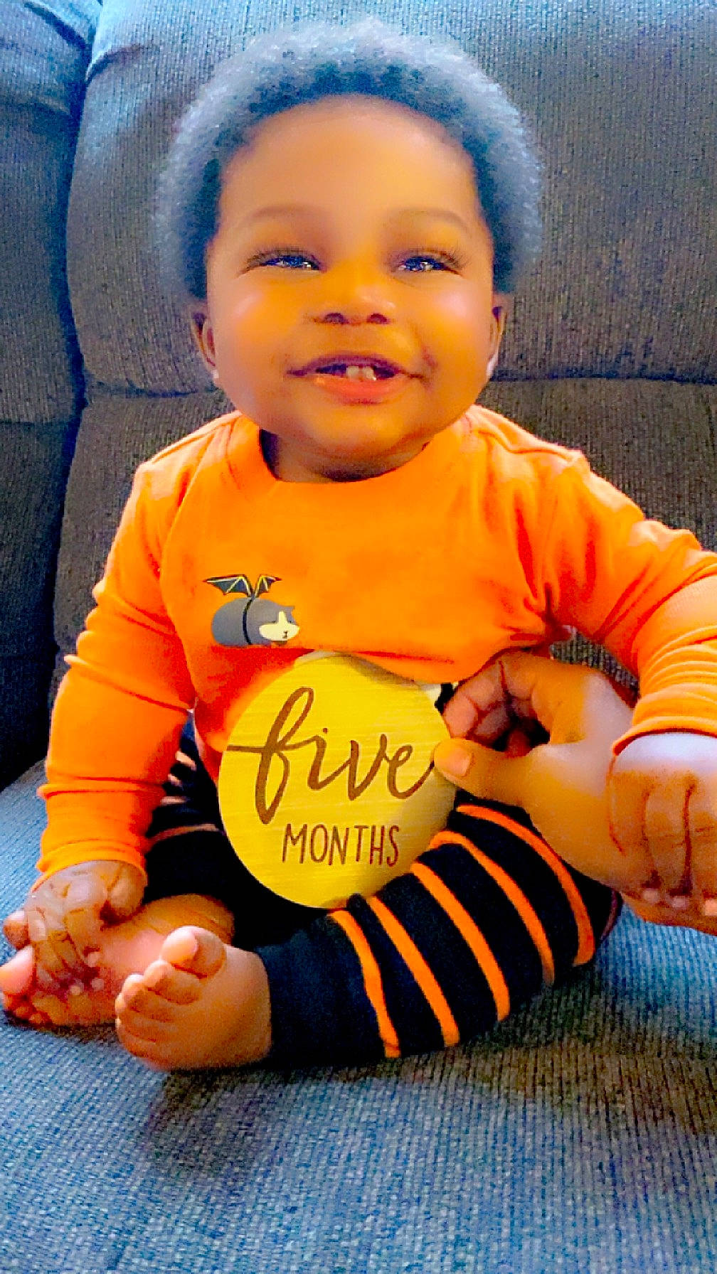 Zaire joined the competition — help win amazing prizes! arm, baby_toddler_clothing, cheek, cool, eye, face, facial_expression, finger, fun, gesture, hand, happy, head, human_body, joy, nose, orange, organ, person, skin