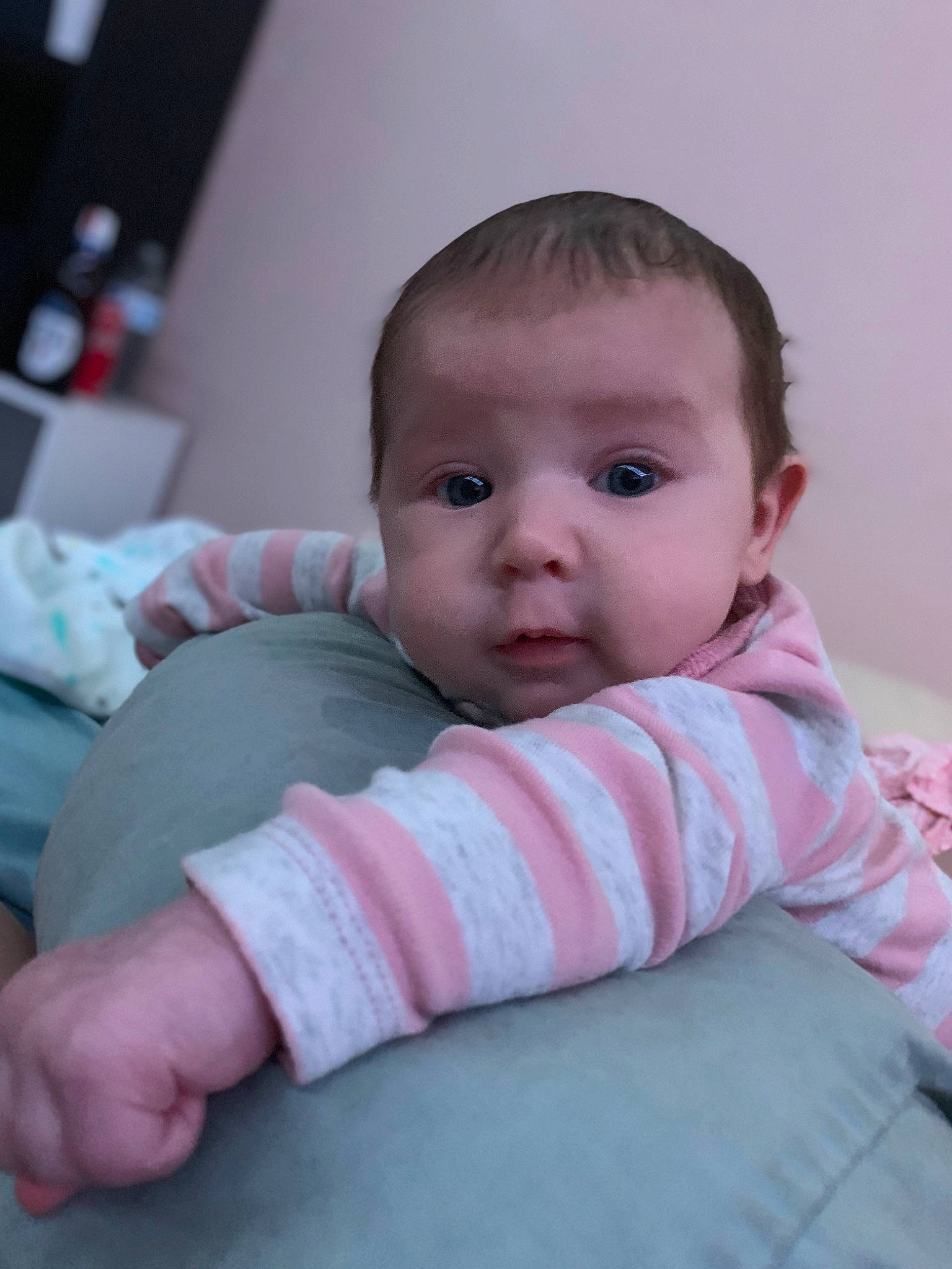 Ameilia is registered to the contest to win money with this photo: baby, baby_toddler_clothing, cheek, child, comfort, eyelash, face, finger, flooring, iris, linens, lip, nose, pattern, person, portrait_photography, room, sitting, skin, sleeve