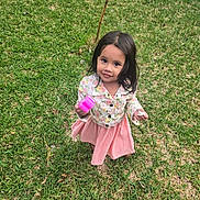 Celestia joined the competition — help win amazing prizes! child, girl, outdoor, grass, toy, smile, curly_hair, jacket, skirt, play, nature, person, young, cute, happy, green, daylight, standing, holding, casual