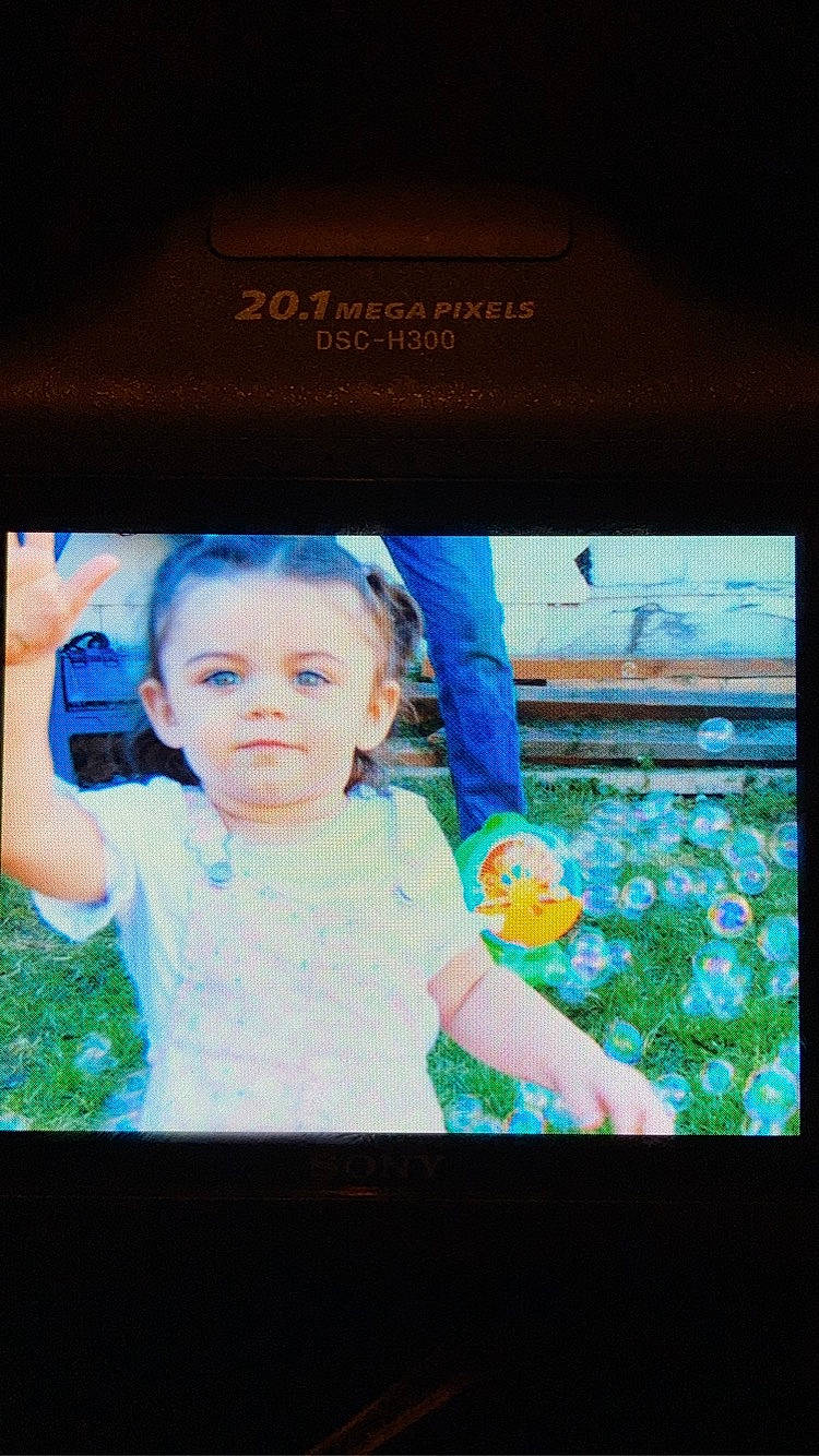 Aniyah joined the competition — help win amazing prizes! baby, baby_toddler_clothing, child, communication_device, display_device, electric_blue, electronic_device, flash_photography, flat_panel_display, flower, fun, gadget, gesture, happy, magenta, multimedia, person, plant, room, television_set