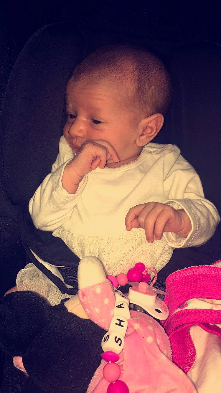 Shayna participe au concours pour gagner de l'argent avec cette photo : baby, cheek, child, ear, eye, facial_expression, finger, fun, hand, lip, mouth, nose, person, pink, play, sitting, skin, smile, thumb, toddler