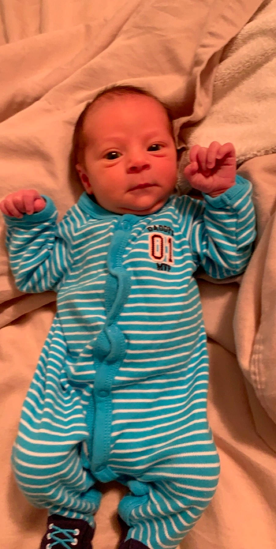 Hayden is registered to the contest to win money with this photo: baby, baby_products, baby_toddler_clothing, blue, cheek, child, eye, face, head, person, product, skin, sleeve, teal, textile, toddler, turquoise