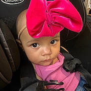 Melody joined the competition — help win amazing prizes! baby, child, car_seat, graco, pink_bow, headband, seatbelt, clothing, tank_top, denim, face, eyes, infant, safety_harness, cute, portrait, indoors, person, seat, young
