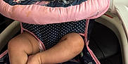 Melody joined the competition — help win amazing prizes! baby, high_chair, infant, child, indoor, pink, navy_blue, floral_pattern, clothing, person, seat, cute, playing, smiling, fingers, legs, feet, skin, head, face