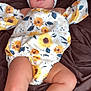 Melody joined the competition — help win amazing prizes! baby, infant, child, headband, bow, sunflower, pattern, outfit, clothing, socks, shoes, blanket, brown, lying_down, cute, face, portrait, indoors, soft_lighting, calm