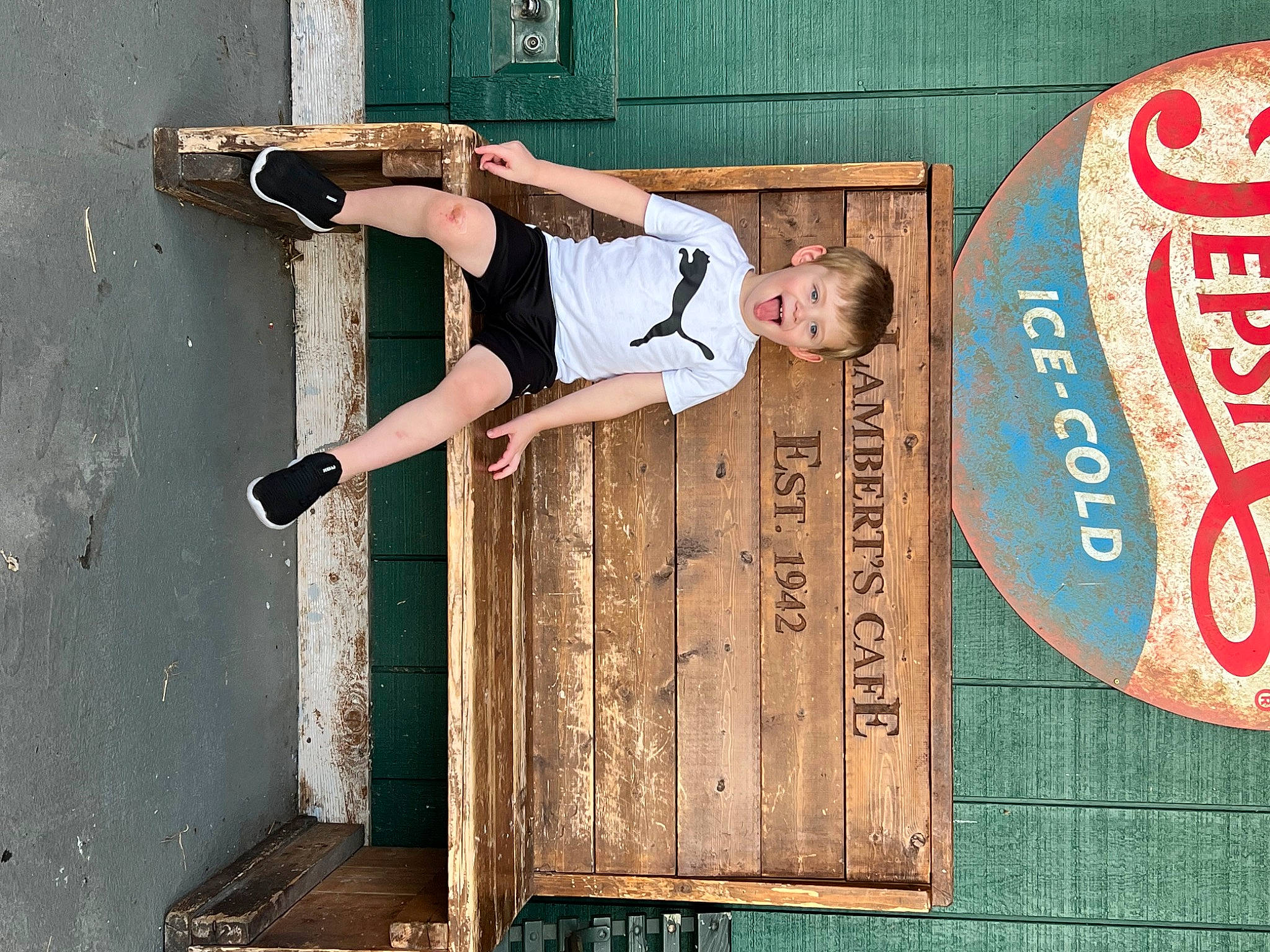 Oliver joined the competition — help win amazing prizes! advertising, brick, cool, door, facade, font, fun, human_leg, leisure, logo, metal, pattern, person, plywood, recreation, room, signage, t_shirt, thigh, wood