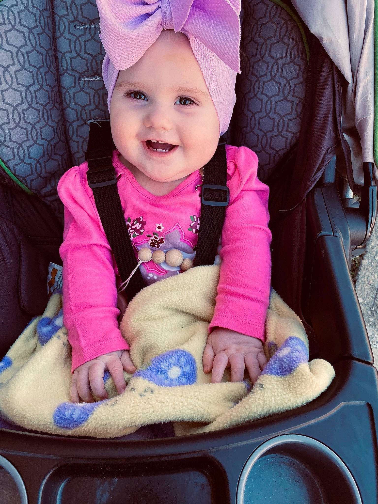 Mckenna joined the competition — help win amazing prizes! baby, baby_carriage, baby_toddler_clothing, blue, cheek, comfort, cool, eye, facial_expression, head, headwear, human, joy, person, photograph, pink, product, purple, skin, smile