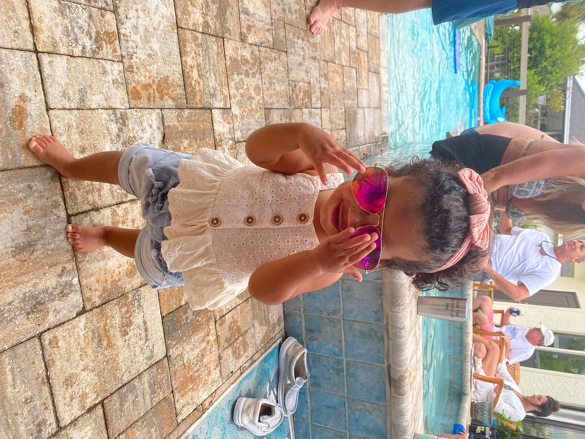 Laiken joined the competition — help win amazing prizes! blue, brick, brickwork, child, eyewear, flooring, fun, green, happy, headwear, human_leg, leisure, person, plant, plumbing_fixture, recreation, shorts, sink, street_fashion, tap