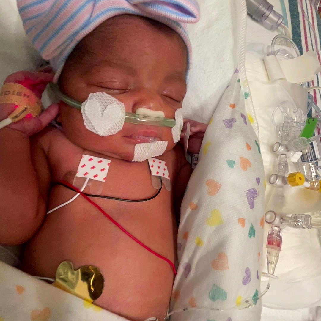 Kailani joined the competition — help win amazing prizes! newborn, baby, sleeping, hospital, nicu, incubator, medical_equipment, monitoring, hat, striped_hat, blanket, heart_pattern, tubes, nasal_cannula, electrodes, premature_baby, portrait, infant, clinical, resting