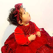 Loriana participe au concours pour gagner de l'argent avec cette photo : celebration, child, curly_hair, cute, dress, fashion, hands, headband, holiday_outfit, indoor, innocence, jewelry, looking_up, necklace, portrait, red_dress, side_profile, sparkles, toddler, young_child