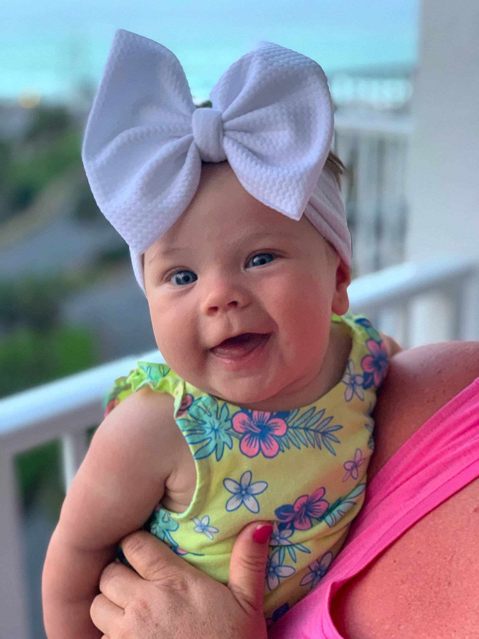 Kylie is registered to the contest to win money with this photo: azure, baby, baby_toddler_clothing, cap, child, electric_blue, face, fashion_accessory, fun, happy, hat, head, headwear, magenta, pattern, person, pink, product, skin, sleeve