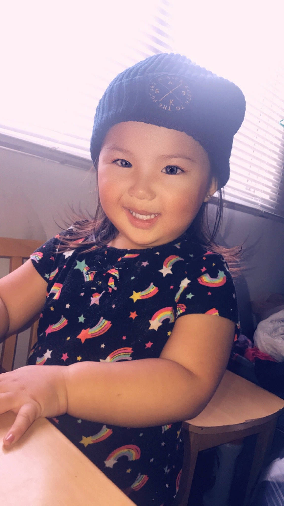Mila is registered to the contest to win money with this photo: black_hair, cap, child, child_model, face, forehead, happy, head, headgear, joy, person, skin, smile, toddler