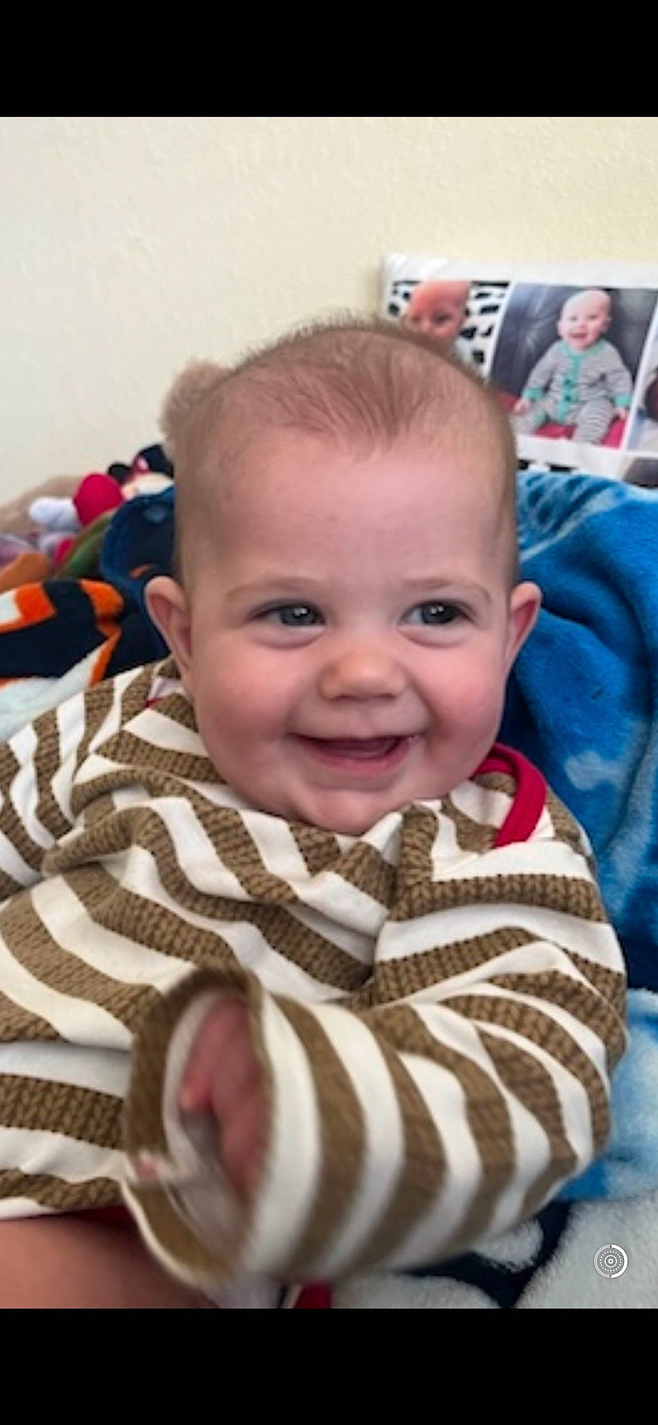 Camryn joined the competition — help win amazing prizes! baby, baby_products, baby_toddler_clothing, cheek, child, comfort, finger, happy, iris, joy, linens, mouth, nose, pattern, person, room, sitting, skin, smile, textile