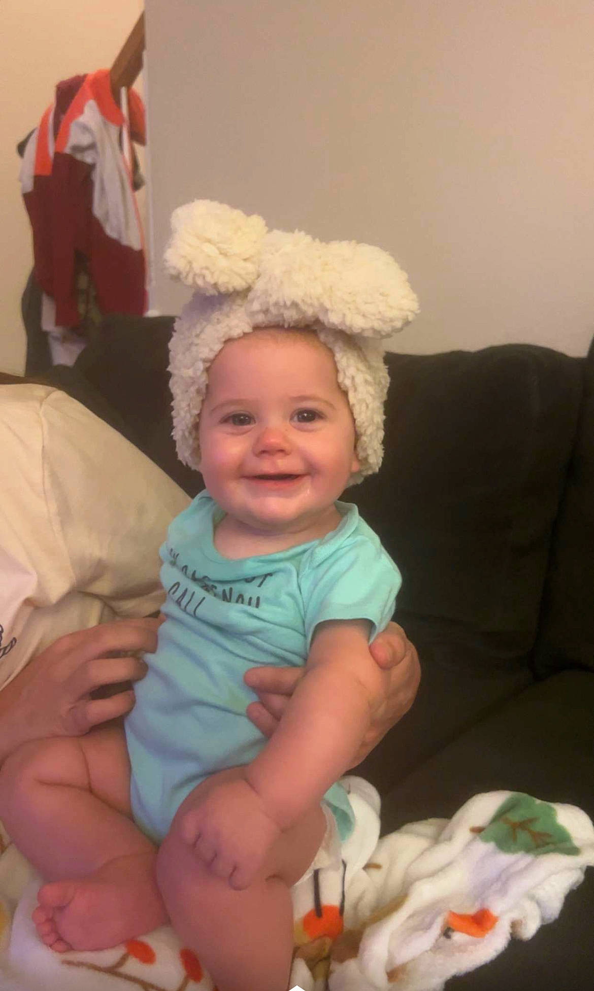 Camryn joined the competition — help win amazing prizes! baby, baby_toddler_clothing, cheek, child, comfort, couch, event, flag, fun, hairstyle, happy, hat, headgear, holiday, joy, lap, person, pink, room, sitting
