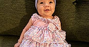 Elatia Jane joined the competition — help win amazing prizes! baby, bow, child, couch, dress, eyes, face, fashion, floral_dress, green, happy, headband, indoor, infant, legs, photography, pink, portrait, sitting, smiling