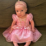 Elatia Jane joined the competition — help win amazing prizes! baby, infant, princess_costume, pink_dress, tiara, couch, green_couch, sitting, cute, child, portrait, indoor, adorable, young_child, headband, small_feet, puffy_sleeves, sparkly, fabric, person