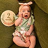 Elatia Jane joined the competition — help win amazing prizes! armchair, baby, barefoot, bow, child, cozy, dress, floral_pattern, green_chair, happy, headband, indoor, infant, milestone_card, open_mouth, photography, portrait, sitting, smiling, two_months