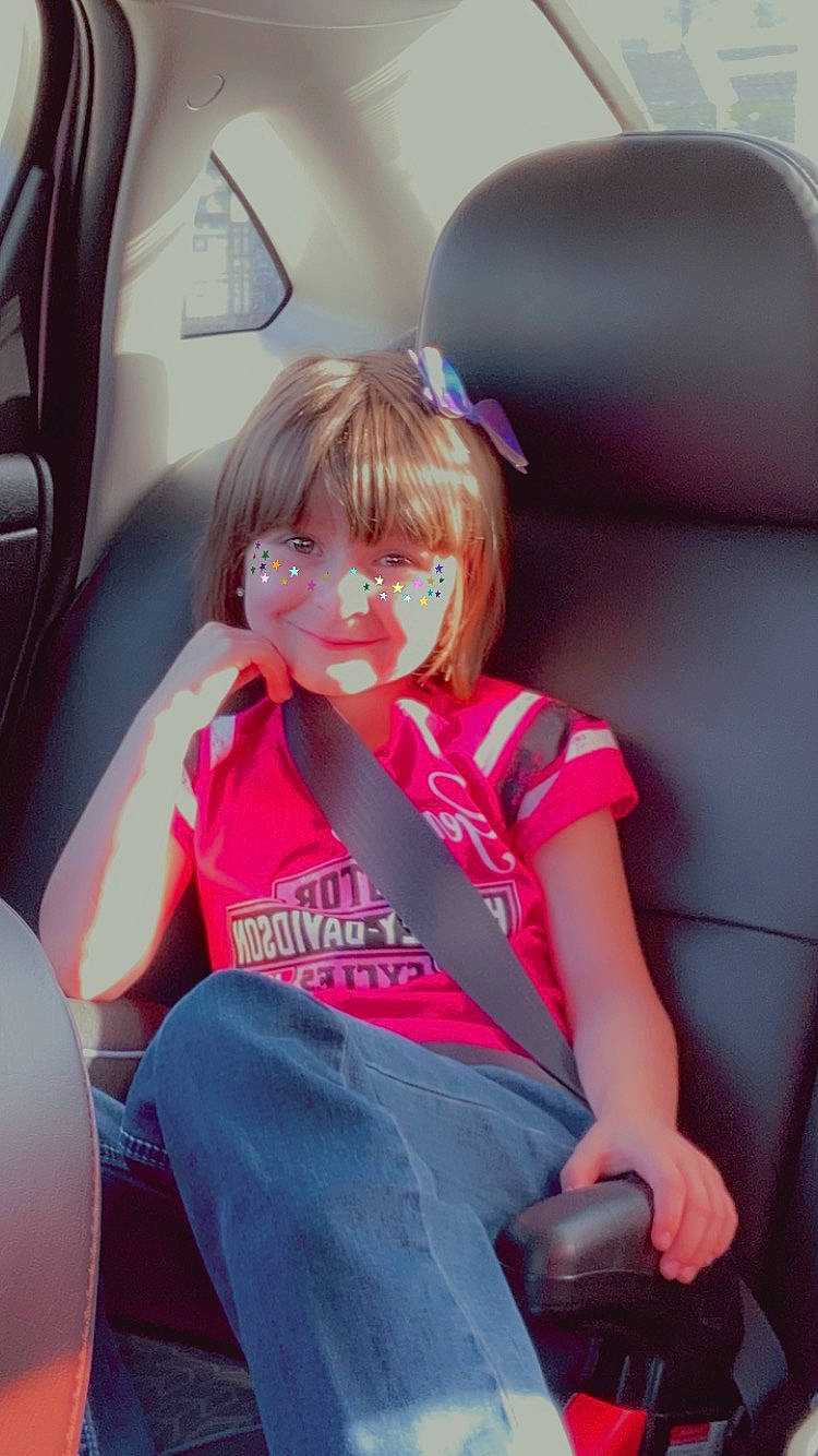 Jessica is registered to the contest to win money with this photo: auto_part, automotive_design, beauty, car_seat, car_seat_cover, comfort, electric_blue, fun, happy, head_restraint, jeans, knee, magenta, motor_vehicle, person, pink, smile, steering_wheel, thigh, toddler