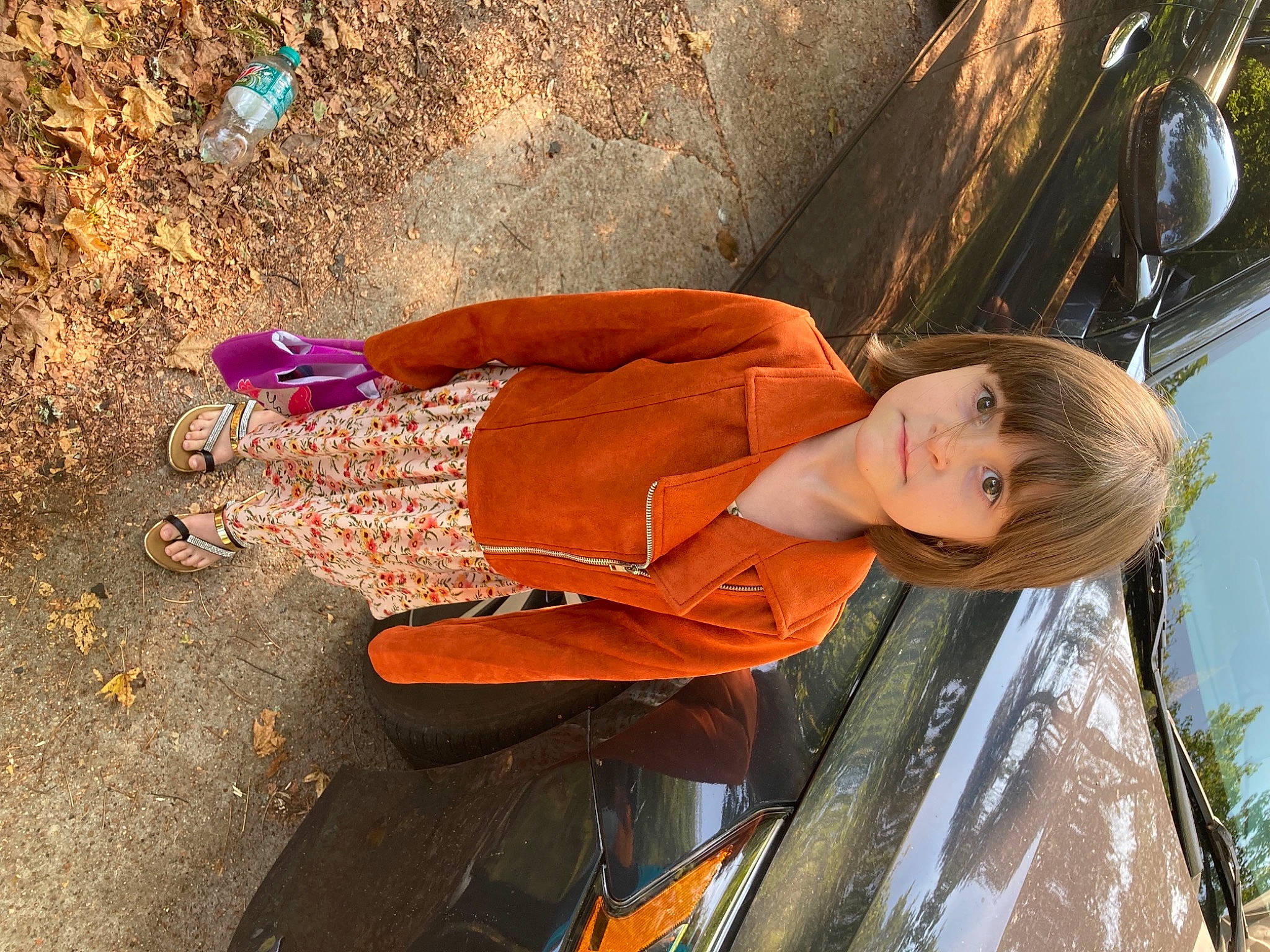 Jessica is registered to the contest to win money with this photo: automotive_design, automotive_exterior, automotive_lighting, beauty, car, electric_blue, fun, hood, human_leg, long_hair, motor_vehicle, orange, people_in_nature, person, street_fashion, summer, tints_and_shades, tire, tree, vehicle_door