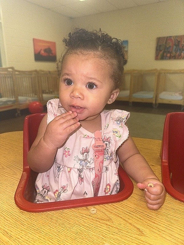 Kaliyah joined the competition — help win amazing prizes! baby, baby_toddler_clothing, chair, cheek, child, chin, drinkware, eyelash, finger, flooring, iris, lip, nose, person, picture_frame, sitting, skin, table, tableware, toddler