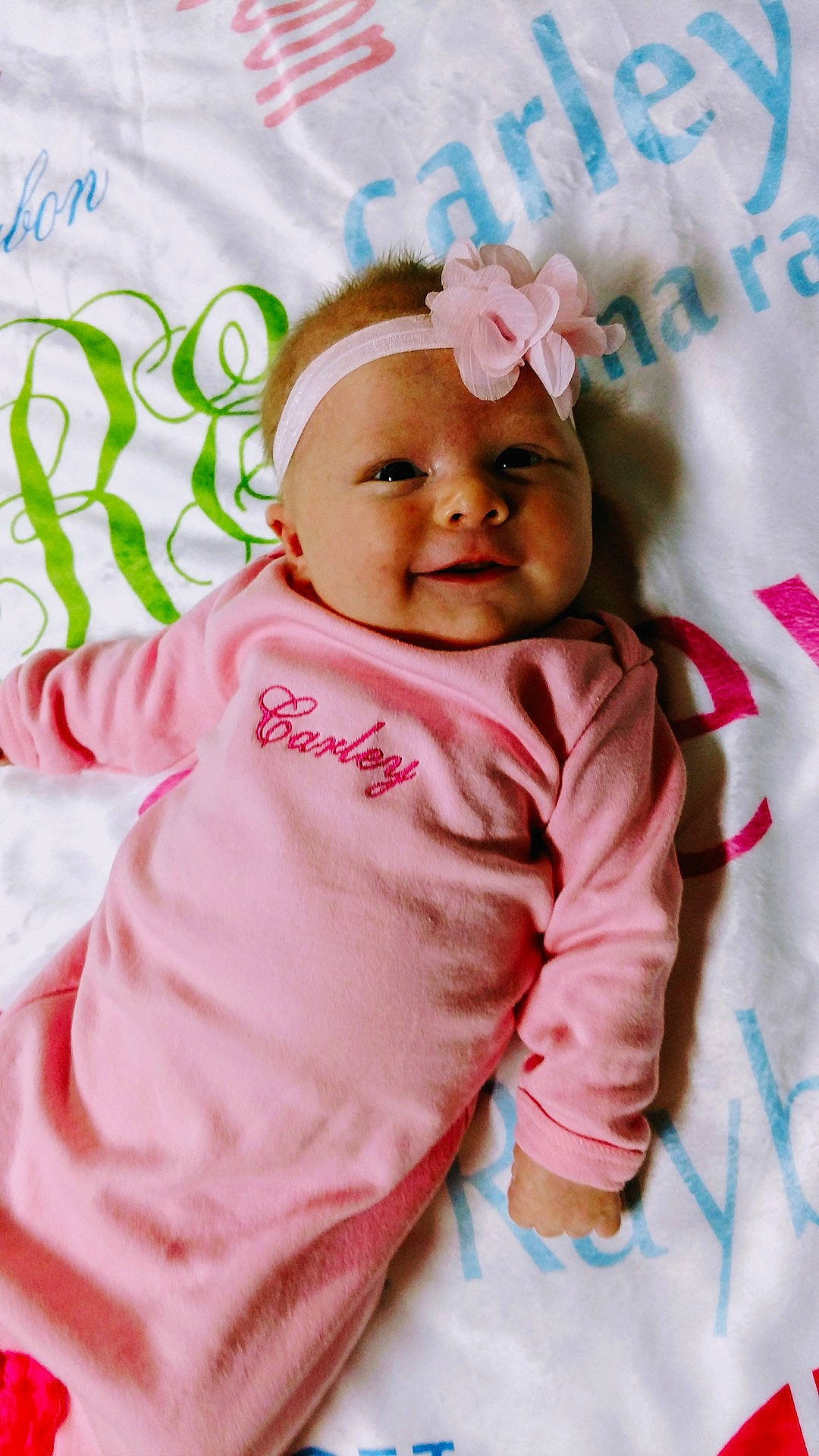 Carley is registered to the contest to win money with this photo: cheek, child, infant, person, pink, play, product, skin, smile, textile, toddler