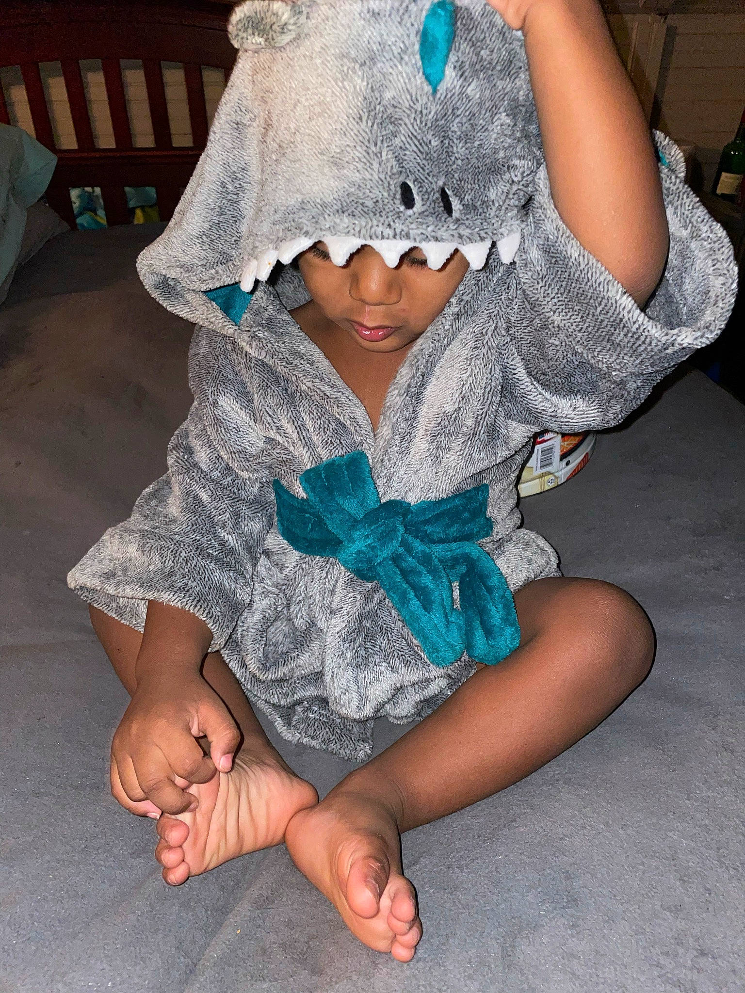 Kamari is registered to the contest to win money with this photo: baby_toddler_clothing, barefoot, bow_tie, cap, chin, costume_hat, eye, fashion_accessory, finger, foot, gesture, happy, headgear, headwear, human_leg, pattern, person, sleeve, t_shirt, textile