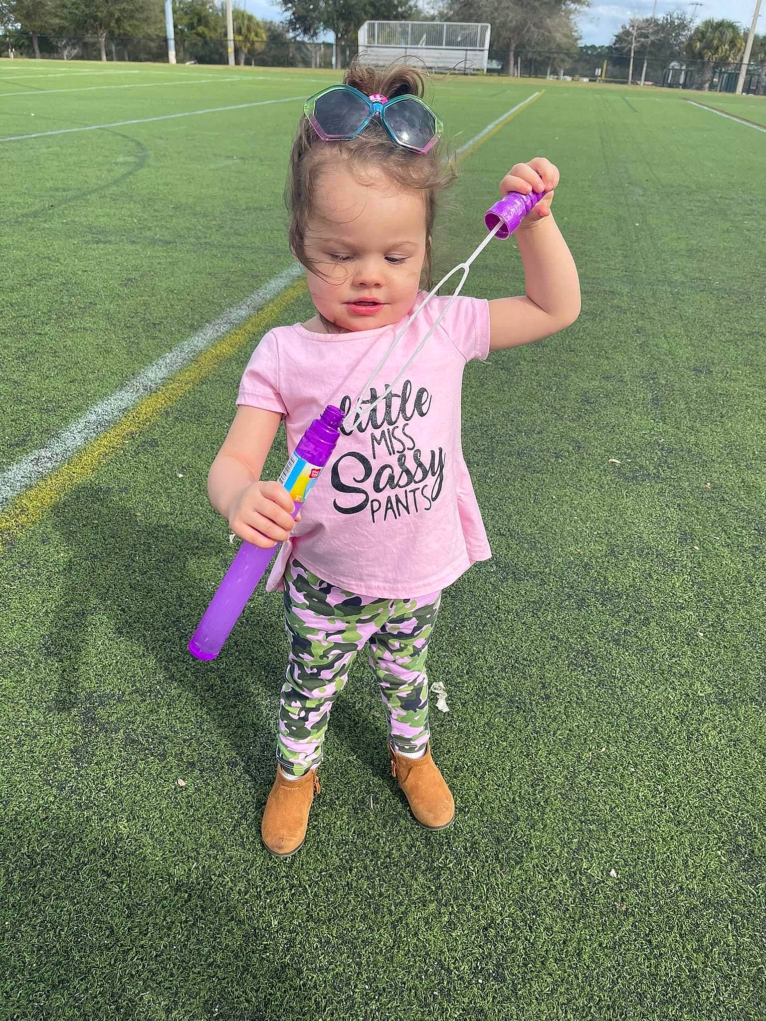 Lina joined the competition — help win amazing prizes! baby_toddler_clothing, child, fun, grass, grassland, happy, lawn, leisure, magenta, meadow, people_in_nature, person, pink, plant, recreation, sky, sleeve, sweatpant, t_shirt, toddler