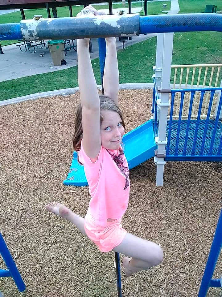 Annalynn joined the competition — help win amazing prizes! balance, child, city, fun, human_settlement, joy, leisure, outdoor_play_equipment, person, physical_fitness, play, playground, public_space, recreation, smile, sportswear, stretching, toddler