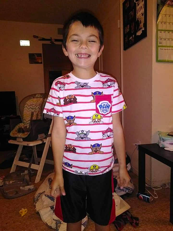 Zayden is registered to the contest to win money with this photo: child, joy, person, shoulder, sleeve, standing, t_shirt, top