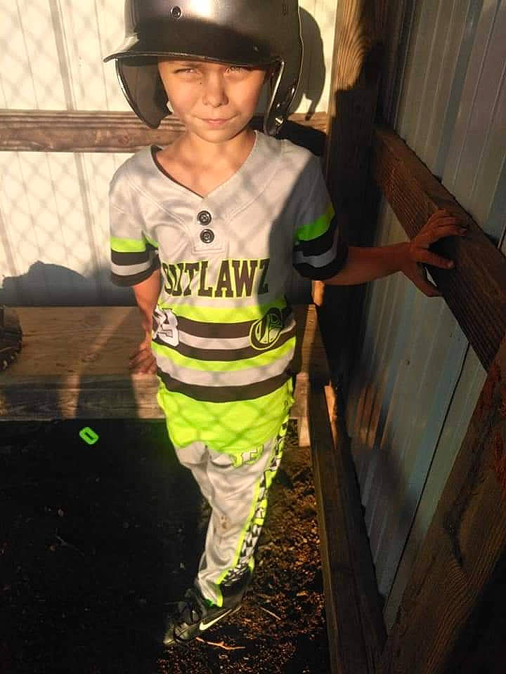 Zayden is registered to the contest to win money with this photo: child, headgear, person, personal_protective_equipment, smile, t_shirt, toddler