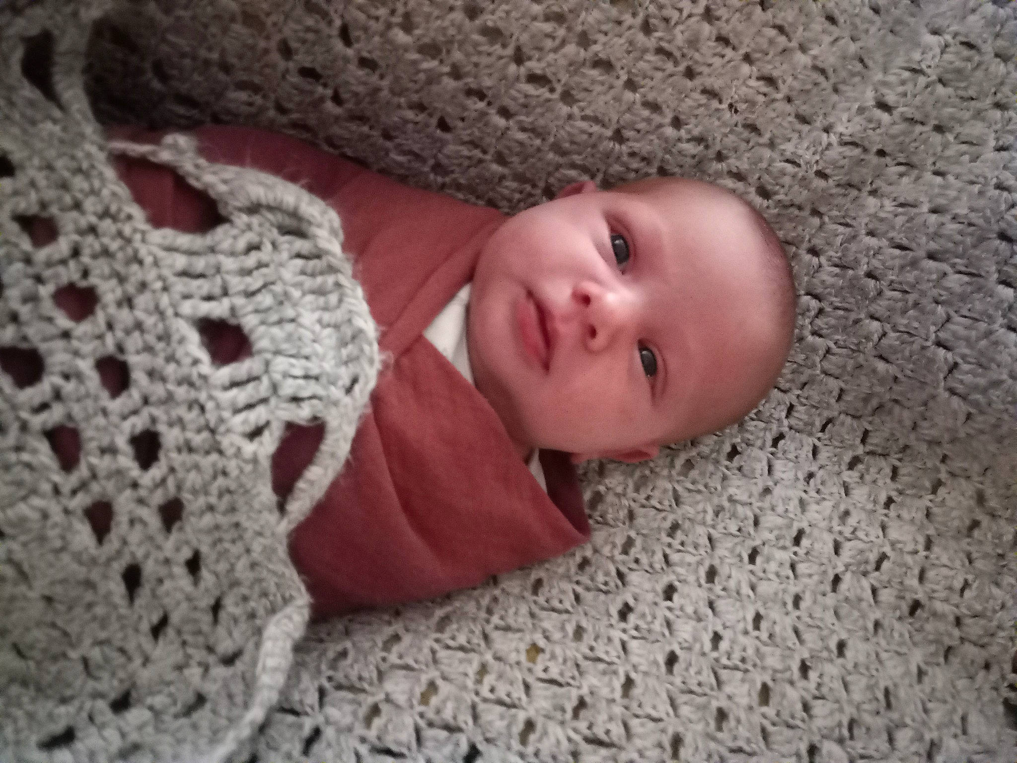 Emmeline joined the competition — help win amazing prizes! baby, baby_toddler_clothing, child, comfort, craft, embellishment, floor, flooring, grey, human_body, linens, pattern, person, skin, smile, textile, toddler, wood, wool, woolen