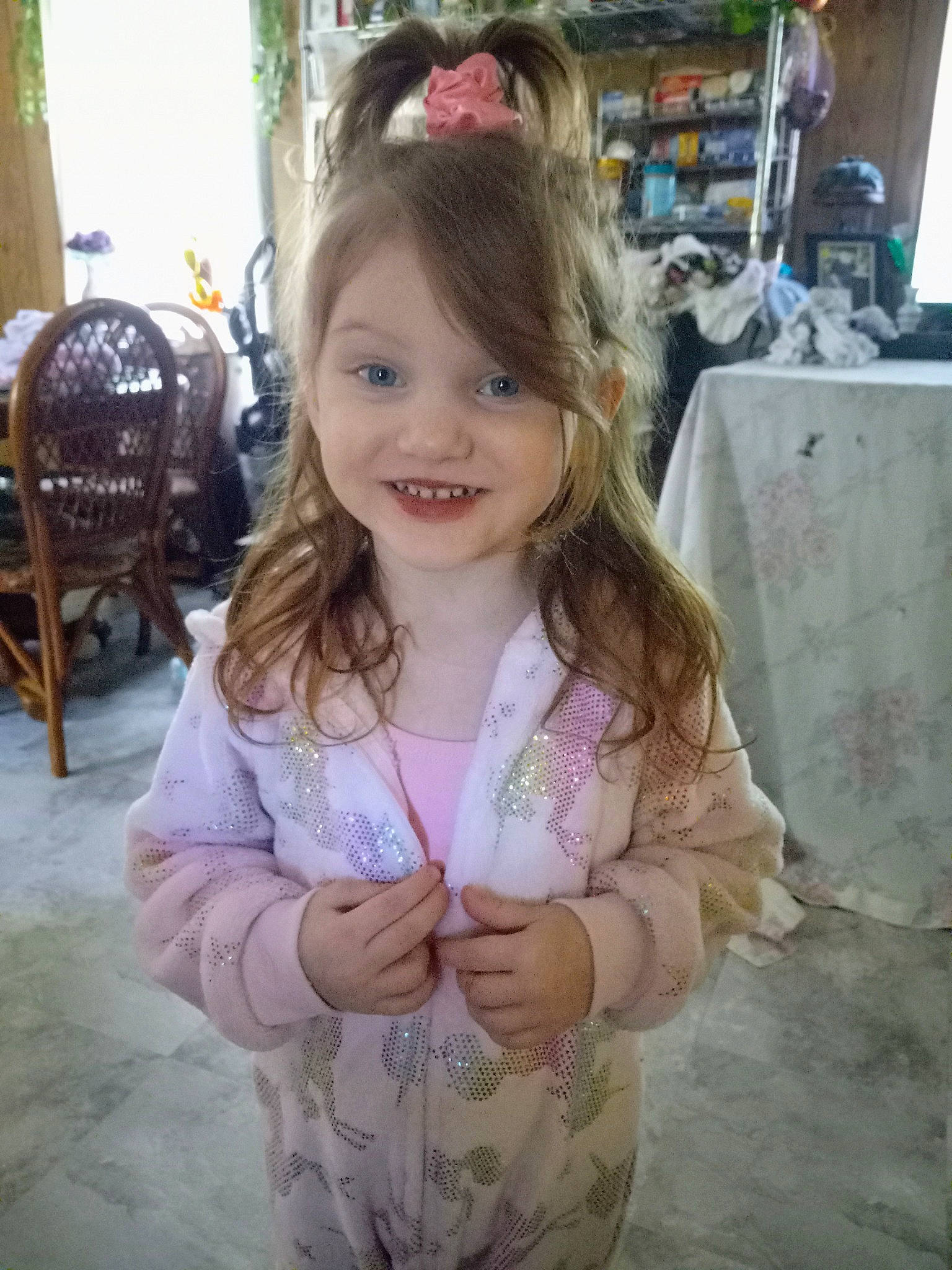 Julianna is registered to the contest to win money with this photo: baby_toddler_clothing, blond, brown_hair, chair, cheek, child, event, eye, fun, happy, iris, joy, long_hair, pattern, person, plant, sitting, skin, sleeve, smile