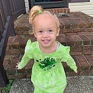 Maya is registered to the contest to win money with this photo: architecture, brick, building, child, city, clothing, coat, door, face, female, girl, happy, head, housing, pants, path, person, photography, portrait, t_shirt