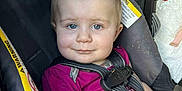Nevaeh joined the competition — help win amazing prizes! baby, child, car_seat, blue_eyes, magenta_shirt, sippy_cup, straps, seat_belt, smile, face, infant, cute, person, portrait, indoor, seat, sitting, looking, hand, clothing