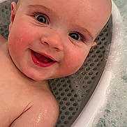 Myles is registered to the contest to win money with this photo: baby, child, smile, face, head, skin, water, bath, bathtub, bubble, foam, wet, happy, infant, person, closeup, cute, cheek, eye, indoors